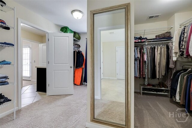 353 Casey Dr, Pooler, GA 31322 - walk in closet with carpet floors and tile patterned flooring