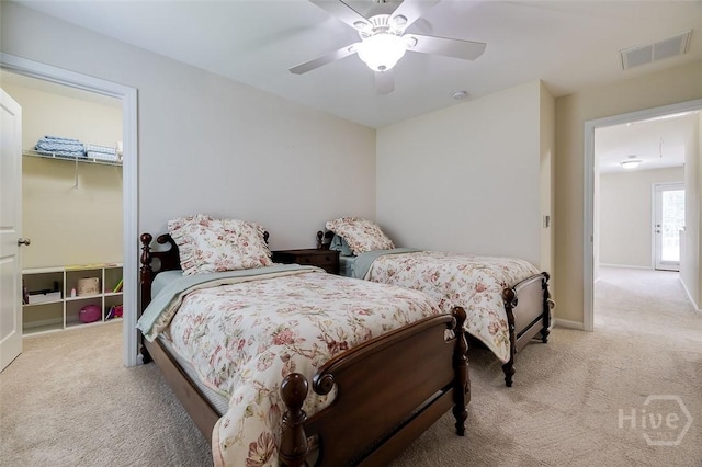 353 Casey Dr, Pooler, GA 31322 - bedroom featuring light colored carpet, a ceiling fan, and a spacious closet