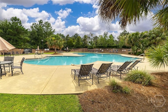 353 Casey Dr, Pooler, GA 31322 - community pool with a patio and view of scattered trees