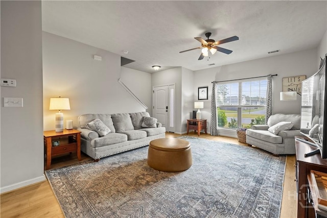 130 Whirlwind Way, Guyton, GA 31312 - living room with a ceiling fan and light wood-style floors