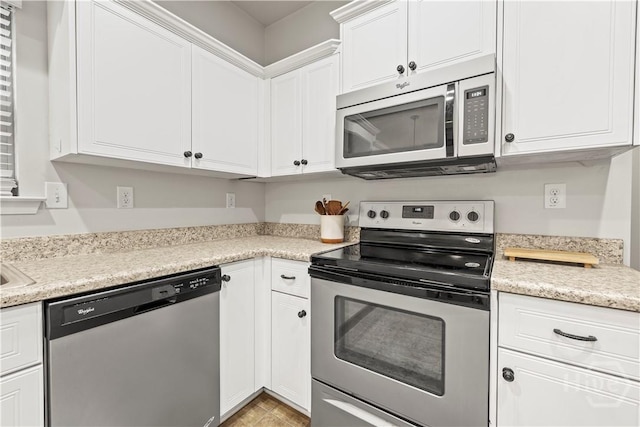 130 Whirlwind Way, Guyton, GA 31312 - kitchen featuring appliances with stainless steel finishes, white cabinetry, and light countertops