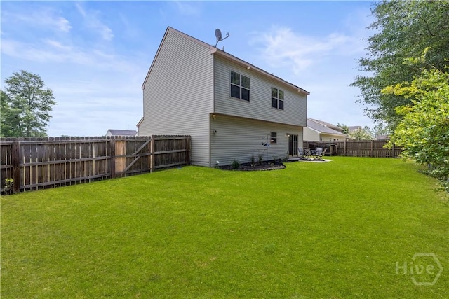 130 Whirlwind Way, Guyton, GA 31312 - rear view of house with a fenced backyard
