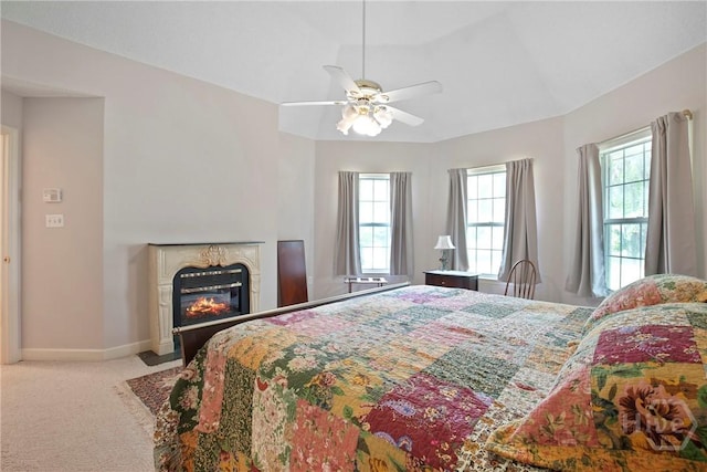 245 Youmans Rd, Midway, GA 31320 - bedroom featuring carpet flooring, a glass covered fireplace, and ceiling fan