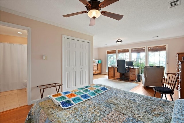 245 Youmans Rd, Midway, GA 31320 - bedroom featuring ornamental molding, an office area, wood finished floors, a closet, and a ceiling fan