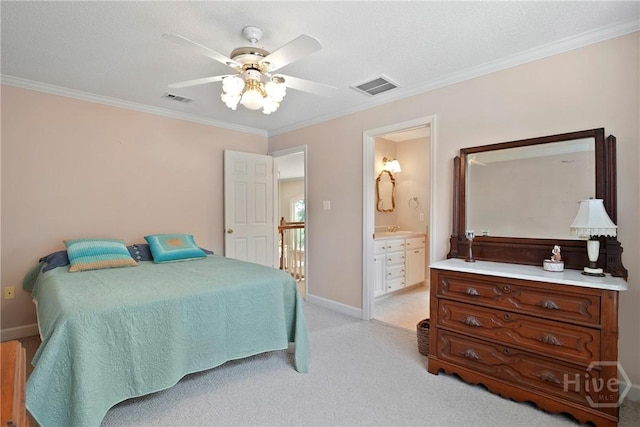 245 Youmans Rd, Midway, GA 31320 - bedroom with crown molding, light colored carpet, connected bathroom, and a ceiling fan