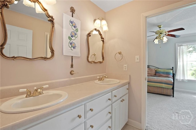 245 Youmans Rd, Midway, GA 31320 - ensuite bathroom with double vanity and ceiling fan