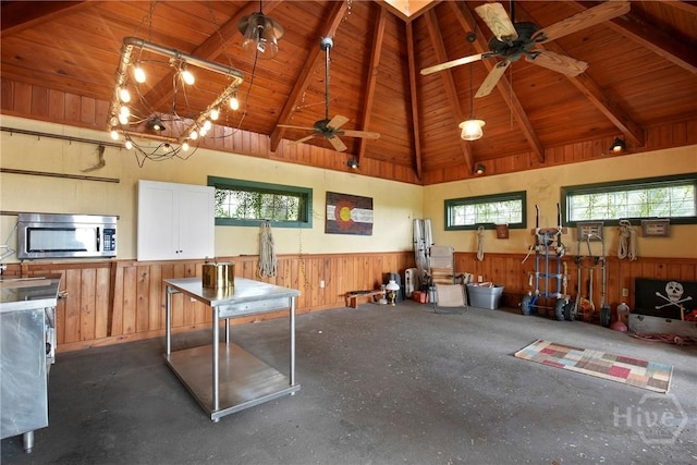 245 Youmans Rd, Midway, GA 31320 - miscellaneous room with wainscoting, a wood ceiling with exposed beams, a ceiling fan, high vaulted ceiling, and wooden walls
