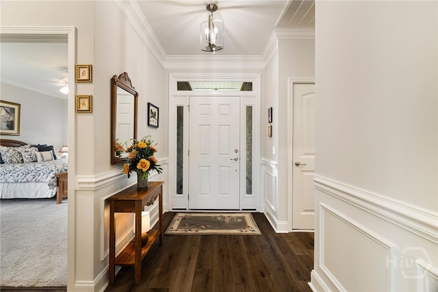 131 Como Dr, Pooler, GA 31322 - foyer entrance featuring ornamental molding, dark wood-style floors, a wainscoted wall, and a decorative wall