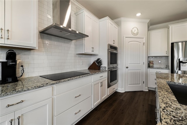 131 Como Dr, Pooler, GA 31322 - kitchen featuring wall chimney range hood, appliances with stainless steel finishes, white cabinetry, light stone counters, and decorative backsplash