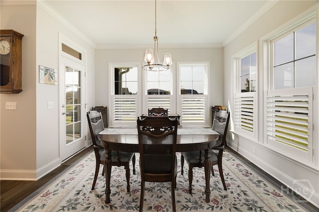 131 Como Dr, Pooler, GA 31322 - dining space featuring wood finished floors, a chandelier, healthy amount of natural light, and crown molding