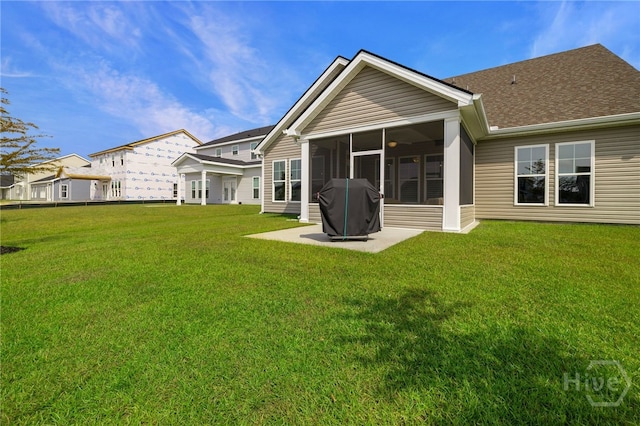 131 Como Dr, Pooler, GA 31322 - back of property with a lawn, a sunroom, and a shingled roof