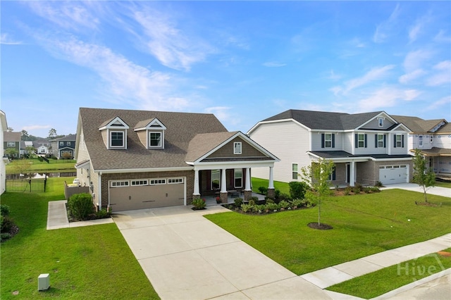 131 Como Dr, Pooler, GA 31322 - view of front of home with driveway, covered porch, a residential view, and an attached garage