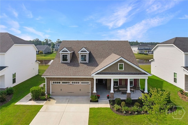 131 Como Dr, Pooler, GA 31322 - craftsman house with covered porch, concrete driveway, brick siding, a residential view, and a front lawn