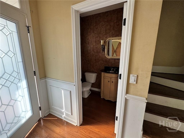 8 Fairgreen St, Savannah, GA 31407 - half bathroom with wood finished floors, a wainscoted wall, and vanity