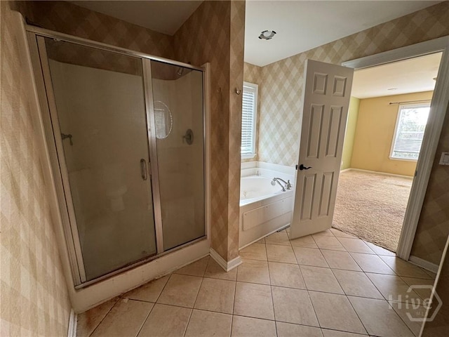 8 Fairgreen St, Savannah, GA 31407 - bathroom featuring wallpapered walls, a bath, a stall shower, and tile patterned flooring