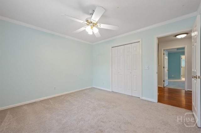 375 Hermitage Dr, Richmond Hill, GA 31324 - unfurnished bedroom featuring carpet floors, ornamental molding, a closet, and a ceiling fan
