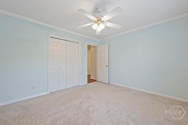 375 Hermitage Dr, Richmond Hill, GA 31324 - unfurnished bedroom with crown molding, light colored carpet, a closet, and ceiling fan