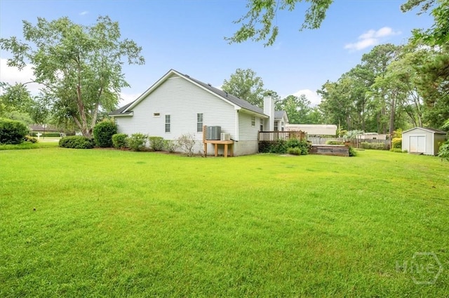 375 Hermitage Dr, Richmond Hill, GA 31324 - view of green lawn with a shed and a deck