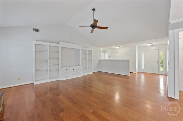 375 Hermitage Dr, Richmond Hill, GA 31324 - unfurnished living room with ceiling fan, vaulted ceiling, and hardwood / wood-style floors