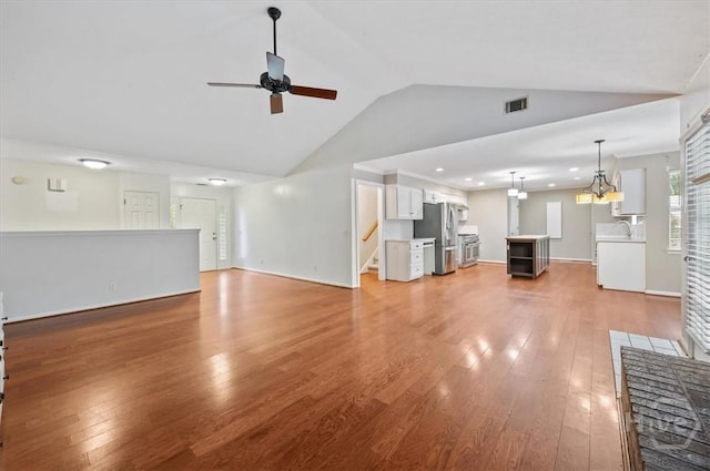 375 Hermitage Dr, Richmond Hill, GA 31324 - unfurnished living room featuring ceiling fan, light wood-type flooring, stairs, recessed lighting, and high vaulted ceiling