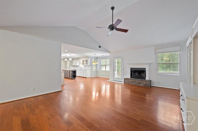 375 Hermitage Dr, Richmond Hill, GA 31324 - unfurnished living room with ceiling fan, wood finished floors, healthy amount of natural light, and vaulted ceiling
