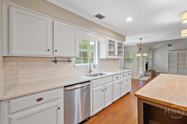 375 Hermitage Dr, Richmond Hill, GA 31324 - kitchen featuring dishwasher, light wood finished floors, light countertops, white cabinets, and recessed lighting
