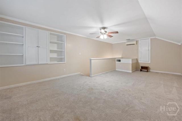 375 Hermitage Dr, Richmond Hill, GA 31324 - additional living space with a ceiling fan, light carpet, a wall mounted air conditioner, lofted ceiling, and built in shelves