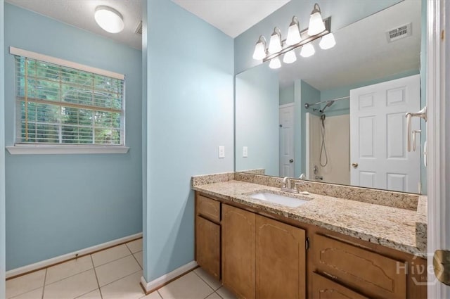375 Hermitage Dr, Richmond Hill, GA 31324 - bathroom with vanity, tile patterned flooring, and a shower