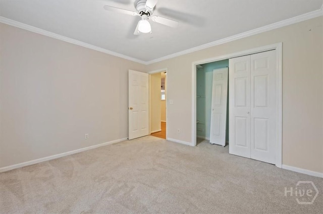 375 Hermitage Dr, Richmond Hill, GA 31324 - unfurnished bedroom with carpet flooring, ornamental molding, a closet, and a ceiling fan