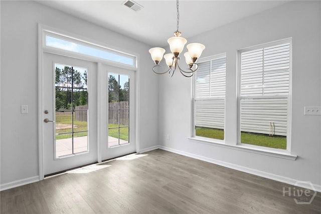 106 Brookline Dr, Savannah, GA 31407 - unfurnished dining area featuring a chandelier and wood finished floors