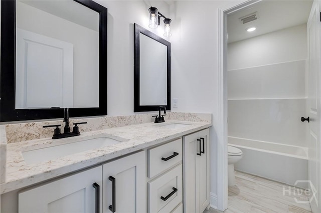 201 Dean Dr, Guyton, GA 31312 - bathroom featuring toilet and double vanity
