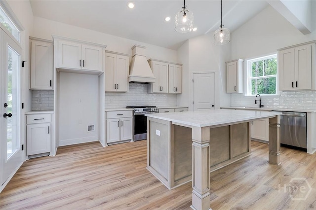 201 Dean Dr, Guyton, GA 31312 - kitchen featuring stainless steel appliances, custom exhaust hood, tasteful backsplash, recessed lighting, and high vaulted ceiling
