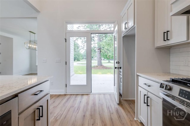201 Dean Dr, Guyton, GA 31312 - kitchen featuring wine cooler, ventilation hood, backsplash, and light wood-type flooring