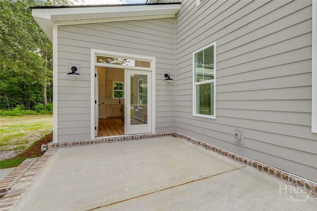 201 Dean Dr, Guyton, GA 31312 - view of exterior entry featuring a patio area