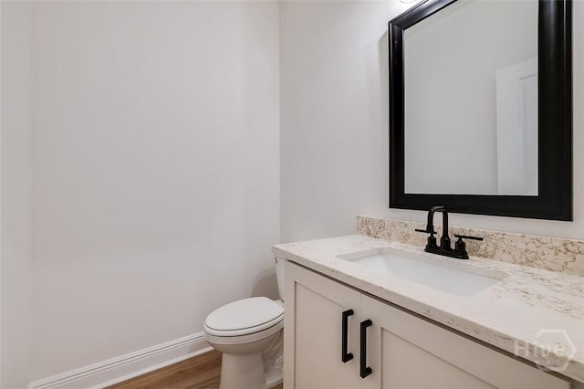 201 Dean Dr, Guyton, GA 31312 - half bath featuring vanity and wood finished floors