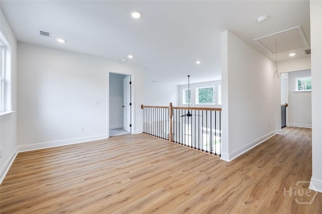 201 Dean Dr, Guyton, GA 31312 - empty room with attic access, light wood-style floors, healthy amount of natural light, recessed lighting, and a smoke detector