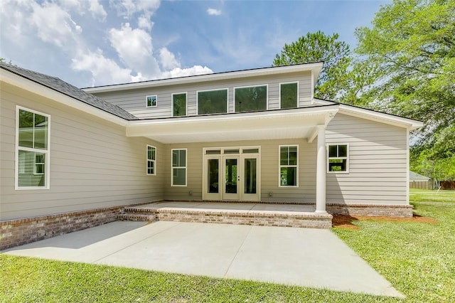 201 Dean Dr, Guyton, GA 31312 - back of property with french doors, a patio area, brick siding, and a yard