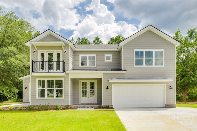 201 Dean Dr, Guyton, GA 31312 - view of front facade featuring french doors, a balcony, driveway, and an attached garage