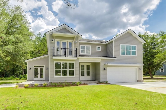 201 Dean Dr, Guyton, GA 31312 - view of front of home with french doors, a balcony, a garage, and a front yard