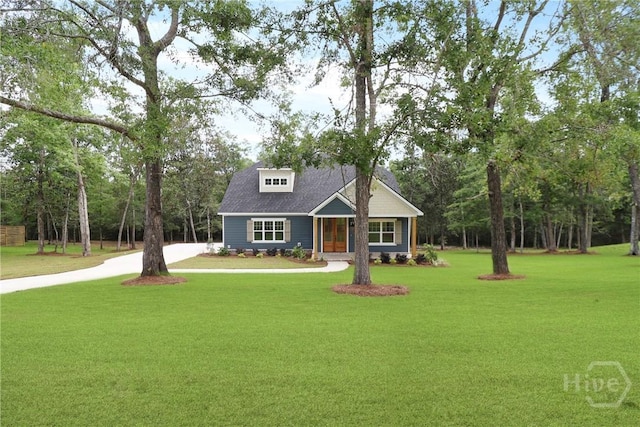 178 Cubbedge Dr, Rincon, GA 31326 - craftsman inspired home featuring a front lawn, concrete driveway, and view of wooded area