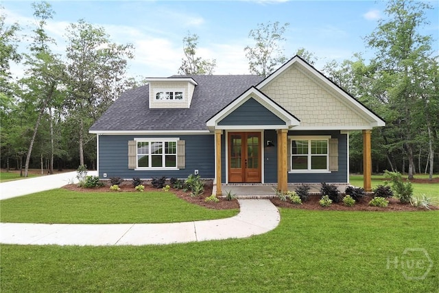 178 Cubbedge Dr, Rincon, GA 31326 - view of front of house featuring french doors, a front yard, and a shingled roof
