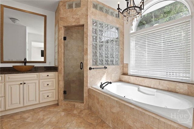 271 Davis Rd, Richmond Hill, GA 31324 - bathroom featuring healthy amount of natural light, a tub with jets, a stall shower, and vanity