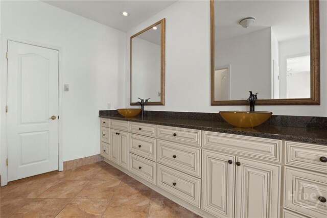 271 Davis Rd, Richmond Hill, GA 31324 - full bathroom featuring double vanity and recessed lighting