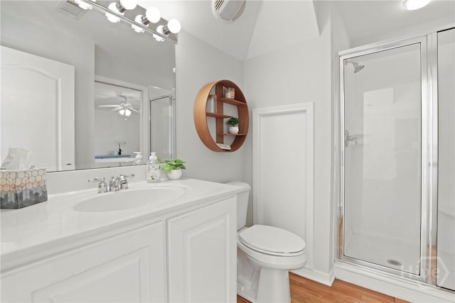 271 Davis Rd, Richmond Hill, GA 31324 - bathroom featuring a shower stall, vanity, wood finished floors, and a ceiling fan