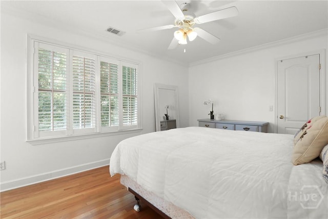 271 Davis Rd, Richmond Hill, GA 31324 - bedroom featuring crown molding, wood finished floors, and a ceiling fan