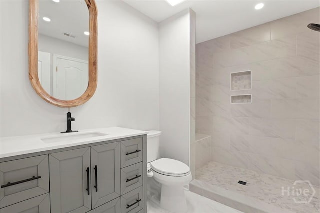 271 Davis Rd, Richmond Hill, GA 31324 - full bath featuring vanity, a tile shower, recessed lighting, and marble look tile flooring