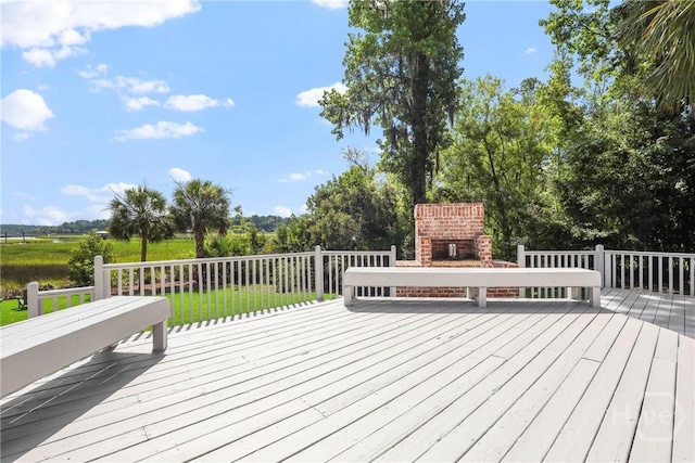 271 Davis Rd, Richmond Hill, GA 31324 - wooden terrace featuring an outdoor brick fireplace and a lawn