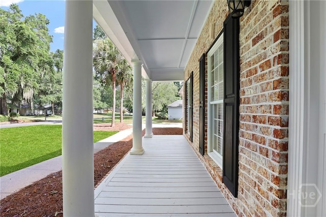 271 Davis Rd, Richmond Hill, GA 31324 - covered porch featuring a yard