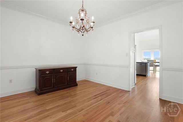 271 Davis Rd, Richmond Hill, GA 31324 - unfurnished dining area with a chandelier, light wood-type flooring, and ornamental molding