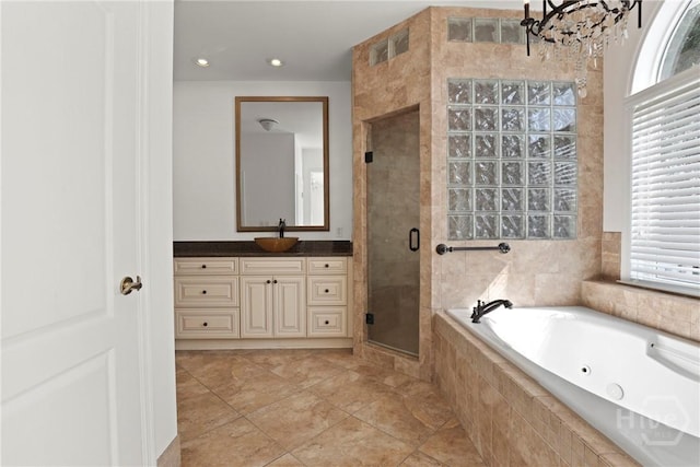 271 Davis Rd, Richmond Hill, GA 31324 - full bath with a jetted tub, a stall shower, a chandelier, and vanity